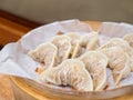 Fresh gyoza steamed Korean dumplings Mandu on bamboo steamer