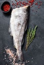 Fresh haddock fish carcass. Black background. Top view Royalty Free Stock Photo