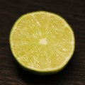 Fresh half green lime isolated on a black background Royalty Free Stock Photo