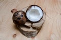 Fresh halved coconut on light wooden background. Organic healthy food concept. Beauty and SPA. Eco nature style. Rustic Royalty Free Stock Photo