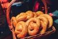 Fresh handmade original Bavarian pretzels from the domestic master baker on a green checkered tea towel many blurry