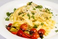 Fresh handmade tagliatelle pasta with forest mushrooms, parsley and cherry tomatoes salad Royalty Free Stock Photo