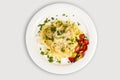 Fresh handmade tagliatelle pasta with forest mushrooms, parsley and cherry tomatoes salad Royalty Free Stock Photo