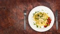 Fresh handmade tagliatelle pasta with forest mushrooms, parsley and cherry tomatoes salad Royalty Free Stock Photo