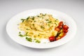 Fresh handmade tagliatelle pasta with forest mushrooms, parsley and cherry tomatoes salad Royalty Free Stock Photo