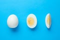 Fresh hard boiled eggs on light blue background, flat lay