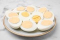 Fresh hard boiled eggs on white marble table