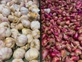 Flat Lay, Close-Up of Red Onions and Garlic in a Basket at a Supermarket Royalty Free Stock Photo