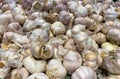 Flat Lay, Close-Up of Red Onions and Garlic in a Basket at a Supermarket Royalty Free Stock Photo