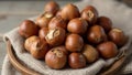 Fresh hazelnuts with shells on rustic cloth Royalty Free Stock Photo