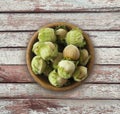 Fresh hazelnuts on wooden background. Hazelnuts in a bowl with copy space for text. Hazelnut close-up on rustic table. Royalty Free Stock Photo