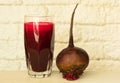 Fresh and healthy beetroot juice and beets on a white table. Close-up. Royalty Free Stock Photo