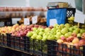 Fresh healthy bio red and green apples on street farmer market. Typical local agricultural fair of weekend. Ripe organic fruits. Royalty Free Stock Photo