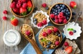 Fresh healthy breakfast with muesli and berries, vitamins, wooden background Royalty Free Stock Photo