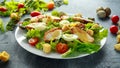 Fresh healthy Caesar salad with chicken, egg quail, tomatoes, Cheese and Croutons in a white plate Royalty Free Stock Photo
