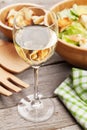 Fresh healthy caesar salad and white wine Royalty Free Stock Photo