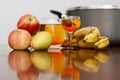 Fresh Healthy Fruits and Juice on Kitchen Table with Reflection on Table Royalty Free Stock Photo