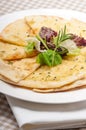 Garlic pita bread pizza with salad on top