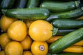 Fresh healthy green zucchini courgettes cucumber in brown wooden box on the marketplace Royalty Free Stock Photo