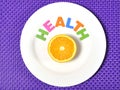 Fresh healthy Orange Fruit and health word on plate Royalty Free Stock Photo