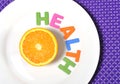 Fresh healthy Orange Fruit and health word on plate Royalty Free Stock Photo