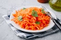 Fresh healthy grated carrot salad in bowl