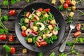 Fresh Healthy Prawns salad with tomatoes, red onion on black plate. concept healthy food Royalty Free Stock Photo