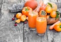 Fresh healthy pulpy cocktail with orange fruits and berries and Royalty Free Stock Photo