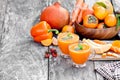 Fresh healthy pulpy cocktail with orange fruits and berries and Royalty Free Stock Photo