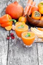 Fresh healthy pulpy cocktail with orange fruits and berries and Royalty Free Stock Photo