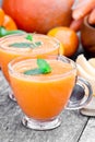 Fresh healthy pulpy cocktail with orange fruits and berries and Royalty Free Stock Photo