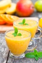 Fresh healthy pulpy juice with orange fruits and vegetables Royalty Free Stock Photo