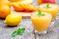 Fresh healthy pulpy juice with orange fruits and vegetables Royalty Free Stock Photo