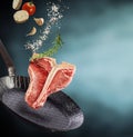 Fresh healthy raw T-bone steak with condiments