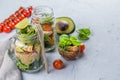 Fresh healthy salad in glass jar and ingredients Royalty Free Stock Photo