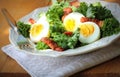 Fresh healthy salad with kale, chrispy bacon and egg Royalty Free Stock Photo