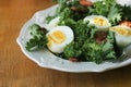 Fresh healthy salad with kale, chrispy bacon and egg Royalty Free Stock Photo