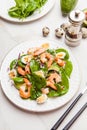 Fresh, healthy salad with shrimps, spinach and avocado on a marble table Royalty Free Stock Photo