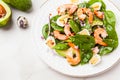 Fresh, healthy salad with shrimps, spinach and avocado on a marble table Royalty Free Stock Photo