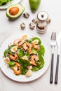 Fresh, healthy salad with shrimps, spinach and avocado on a marble table Royalty Free Stock Photo