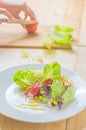 Fresh healthy salad on wooden table. Royalty Free Stock Photo