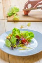 Fresh healthy salad on wooden table. Royalty Free Stock Photo