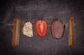 Fresh healthy sandwich ingredients on black background. Cheese, tomato, meat, bread and halloumi Royalty Free Stock Photo