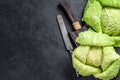 Fresh healthy savoy cabbage. Dark background. Top view. Copy space