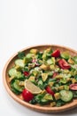 Fresh and healthy summer salad with cucumbers, tomatoes, avocado, arugula, sunflower seeds, lemons and chili flakes. Royalty Free Stock Photo