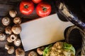 Fresh healthy vegetables on wooden table with white trencher. Rustic style.