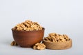 Fresh healthy walnuts in bowl on colored table background. Top view Healthy eating bertholletia concept. Super foods Royalty Free Stock Photo