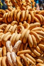 Fresh heap bagels on table. Bundle of bagels are sold at the fair-sale