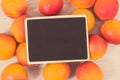 Fresh heap of peach. Healthy dessert as source minerals and vitamins. Place for text on black board Royalty Free Stock Photo