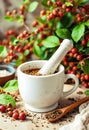 Fresh Herbal Tea Grinding In Cup With Natural Herbs And Rustic Atmosphere Royalty Free Stock Photo